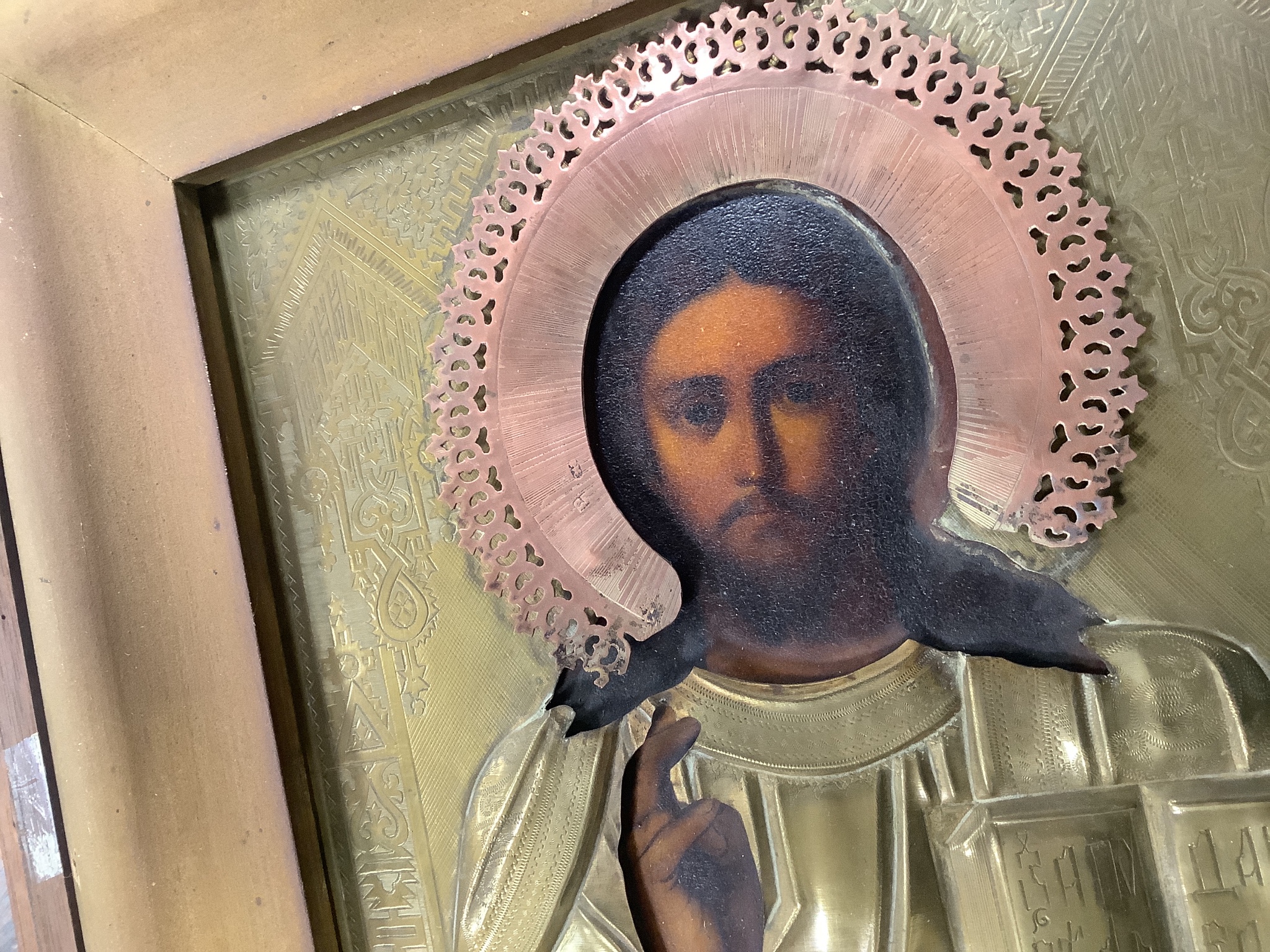 A 19th century Russian icon of Christ Pantocractor, with brass and copper oklad, 26 x 21cm, glazed case